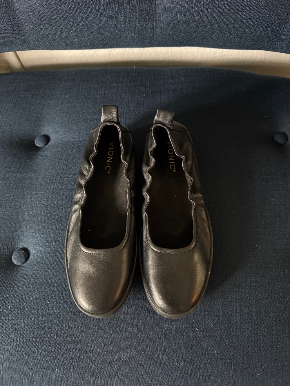 Vionic Uptown Ballet Slip-Ons, crafted from soft black leather w/ Elastic collar